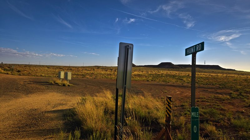 Hunt Rd sign and mile 0 marker at AZ-99